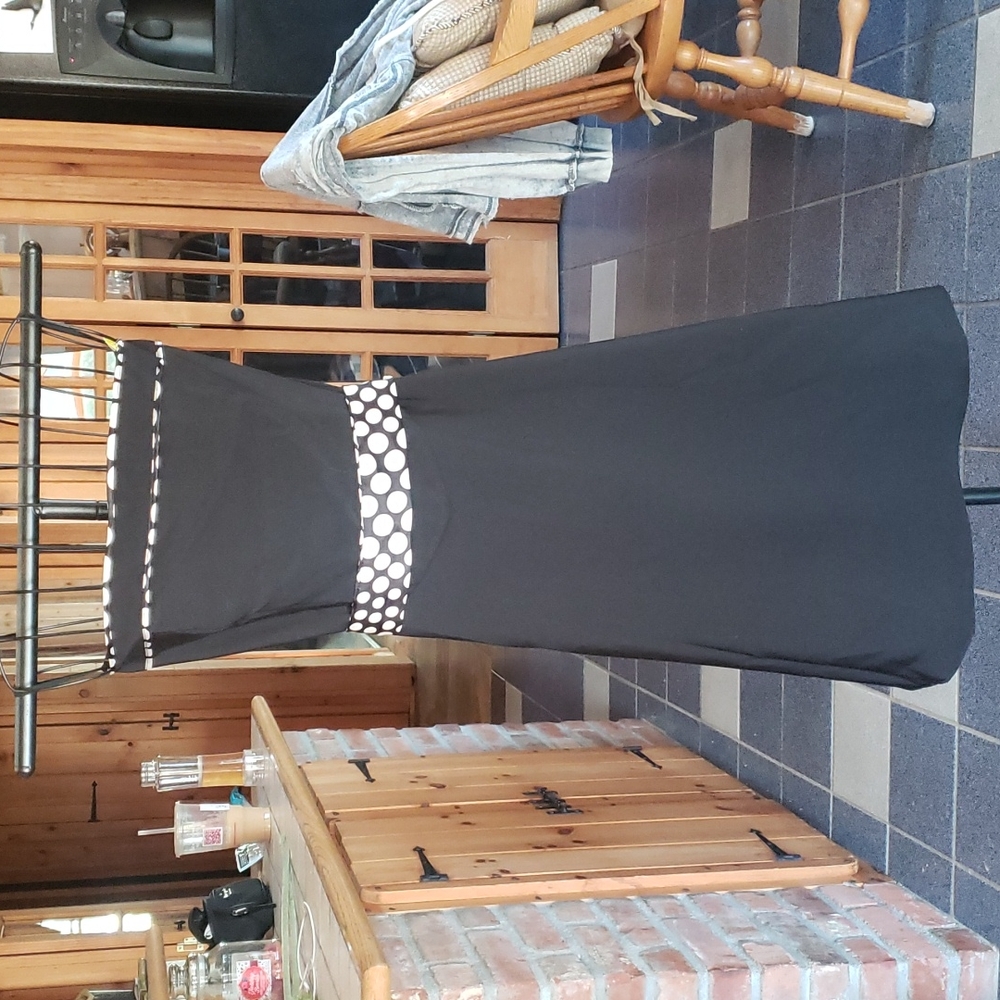 Black dress trimmed with polka dots